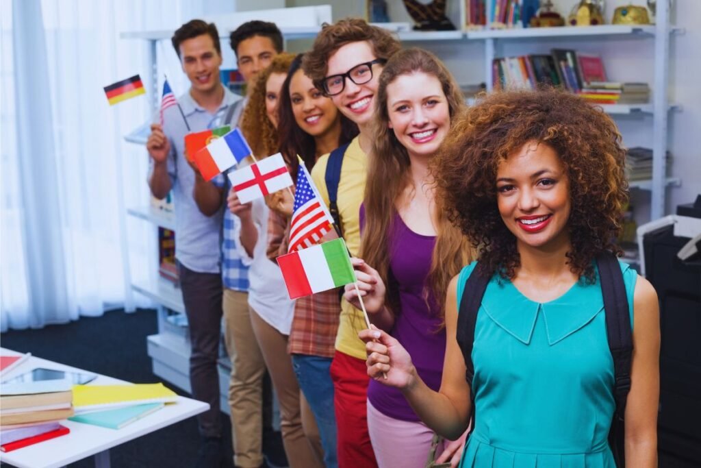 Group of international students holding various national flags, symbolizing cultural diversity and academic aspirations, representing the journey of transitioning to F-1 student status at Stellar Career College.